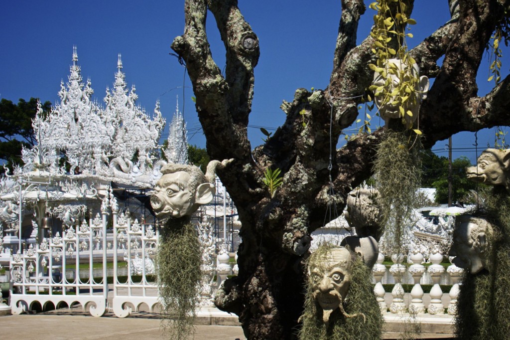 Skulls hanging from tree outside White Temple Chiang Rai